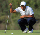 Tiger Woods lines up a putt
