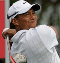 Tiger Woods watches his drive