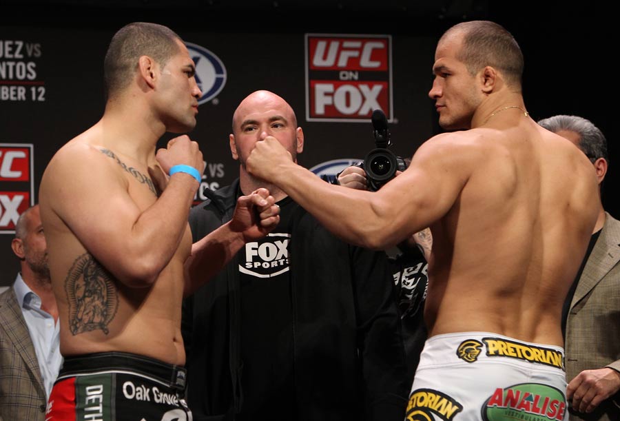 Cain Velasquez and challenger Junior dos Santos strike a pose at the weigh-in ahead of their bout