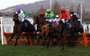 The horses jump the final hurdle in the Greatwood Handicap Hurdle 