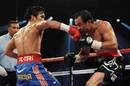 Manny Pacquiao lands a punch on Juan Manuel Marquez