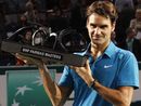 Roger Federer hoists the trophy