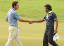 Gonzalo Fernandez-Castano shakes hands with Juvic Pagunsan after winning the Singapore Open