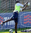 Mario Balotelli turns his hand to goalkeeping during an Italy training session