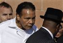 Muhammad Ali leaves Joe Frazier's funeral