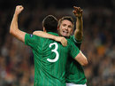 Robbie Keane celebrates with Stephen Hunt
