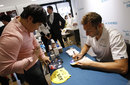 Ian Thorpe signs autographs for a fan