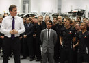 David Cameron addresses the crowd as Lewis Hamilton, Jenson Button and Mark Cavendish look on