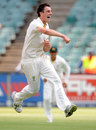 Pat Cummins celebrates his maiden Test wicket 