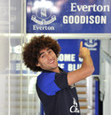 Everton's Marouane Fellaini smiles after signing a new contract