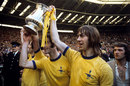 Charlie George holds aloft the FA Cup