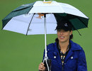 Ana Ivanovic takes cover from the rain