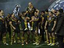 Darren Lockyer is lifted up by team-mates after winning the Four Nations final