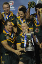 Darren Lockyer shows off the Four Nations trophy