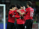 Javier Hernandez is congratulated by his team-mates