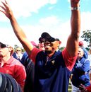 Tiger Woods celebrates after winning his match on the 15th hole