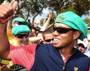 Tiger Woods celebrates with fans after the US defeated an International team