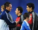 John Terry shakes hands with Luis Suarez