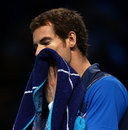 Andy Murray wipes his face with a towel