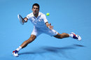 Novak Djokovic stretches to reach a return