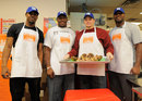 Ramses Barden, Kevin Boothe, Jim Cordle and Chris Canty prepare to deliver Thanksgiving dinners 