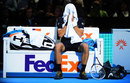 Novak Djokovic hides his head in his towel