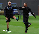 Gabriel Obertan and Danny Simpson warm up during a training session
