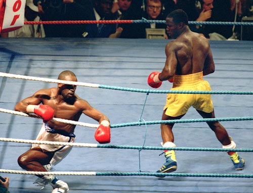 Nigel Benn fights back from his knees to earn a draw with Chris Eubank