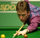 Ken Doherty lines up a shot against Liang Wenbo