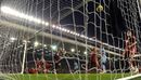 Vincent Kompany's header loops over Pepe Reina and into the net