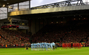 Liverpool and Manchester City players observe a minute's silence