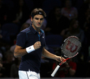 Roger Federer pumps his fist after a break of serve
