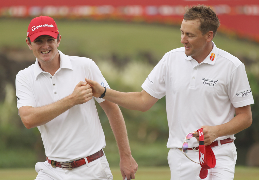 Justin Rose and Ian Poulter celebrate their round of 63