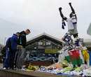 Fans look at the tributes to Gary Speed