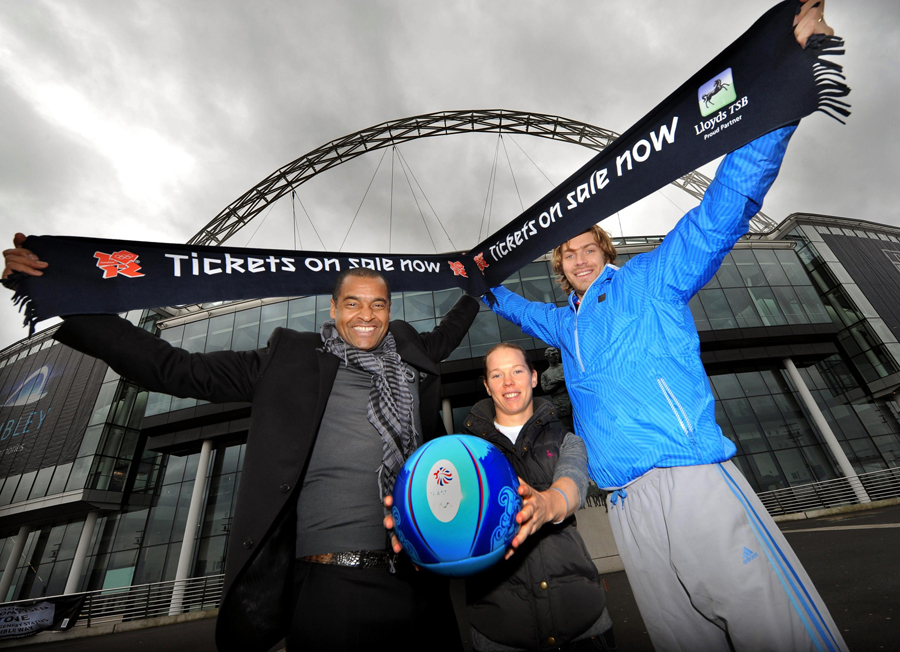 Mark Bright, Dani Buet and Chris Tomlinson stand outside Wembley