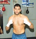 Amir Khan throws his fists up