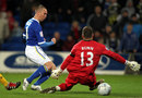 Cardiff striker Kenny Millar shoots past Mark Bunn