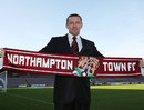 Aidy Boothroyd poses on the pitch after being confirmed as Northampton Town's new manager