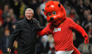 Sir Alex Ferguson shares a moment with Fred the Red