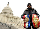 Amir Khan poses with his belts in front of the US Capitol Building