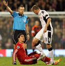 Fulham's Danny Murphy and Liverpool's Luis Suarez exchange words