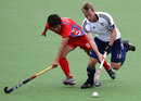 Barry Middleton comes under pressure from Kyu Yeob Jang 