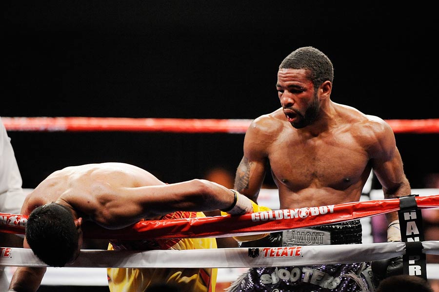 Lamont Peterson's punches drape Amir Khan over the ropes