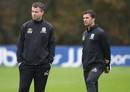 Wales manager Gary Speed observes training with coach Raymond Verheijen
