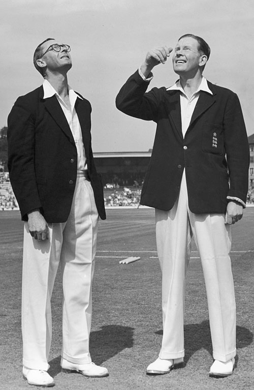 New Zealand captain Walter Hadlee watches as England captain Freddie Brown tosses the coin