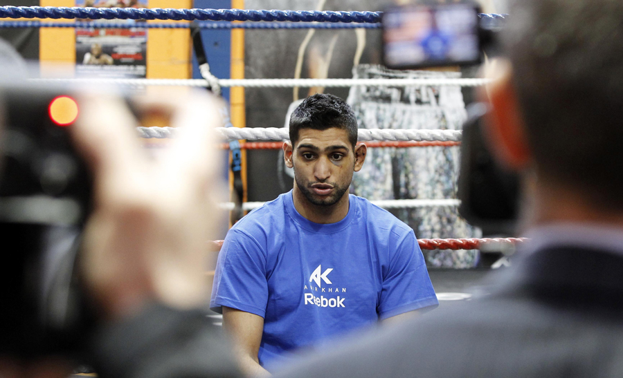 Amir Khan faces the media during a press conference