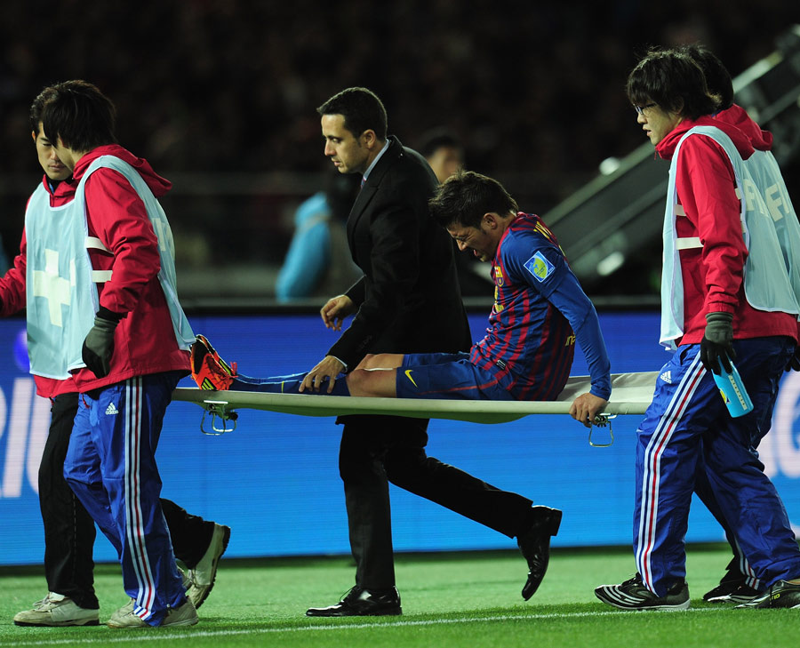 David Villa is stretchered off after breaking his left leg