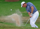 Lee Westwood splashes out of a bunker