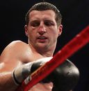 Carl Froch leans on the ropes during his bout against Andre Ward