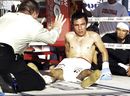 Adrian Hernandez sits on the mat after being knocked down by Kompayak CP Freshmart